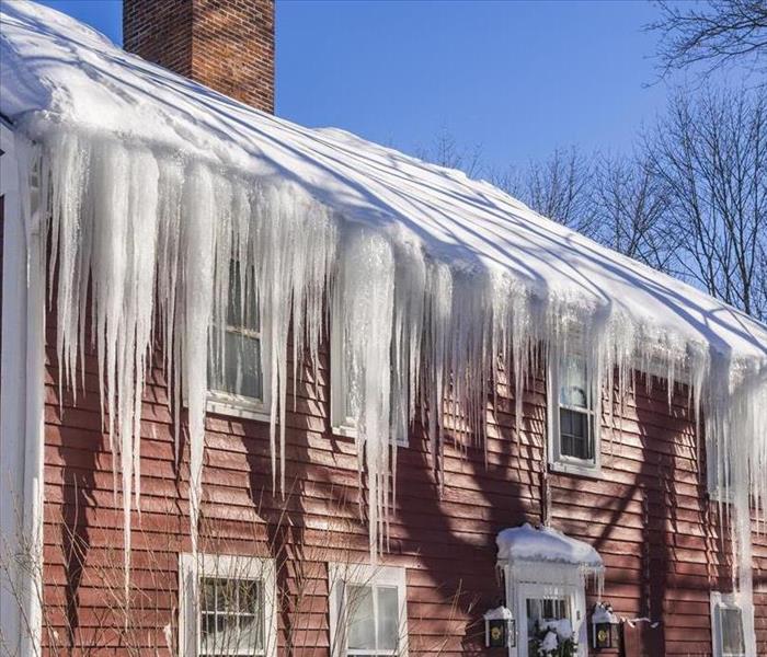 Gutters full with Ice Dam